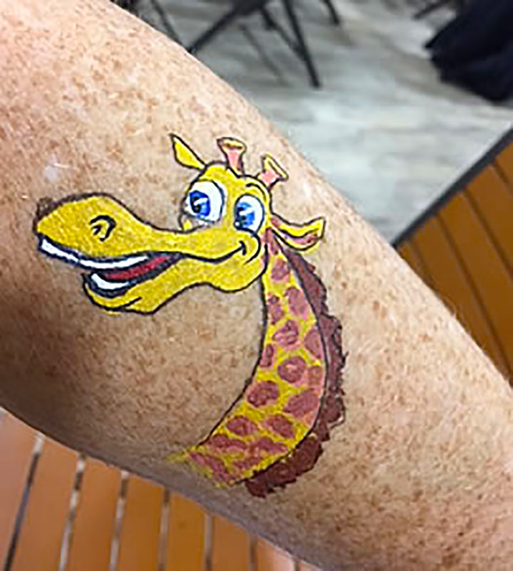 A painted giraffe arm design
